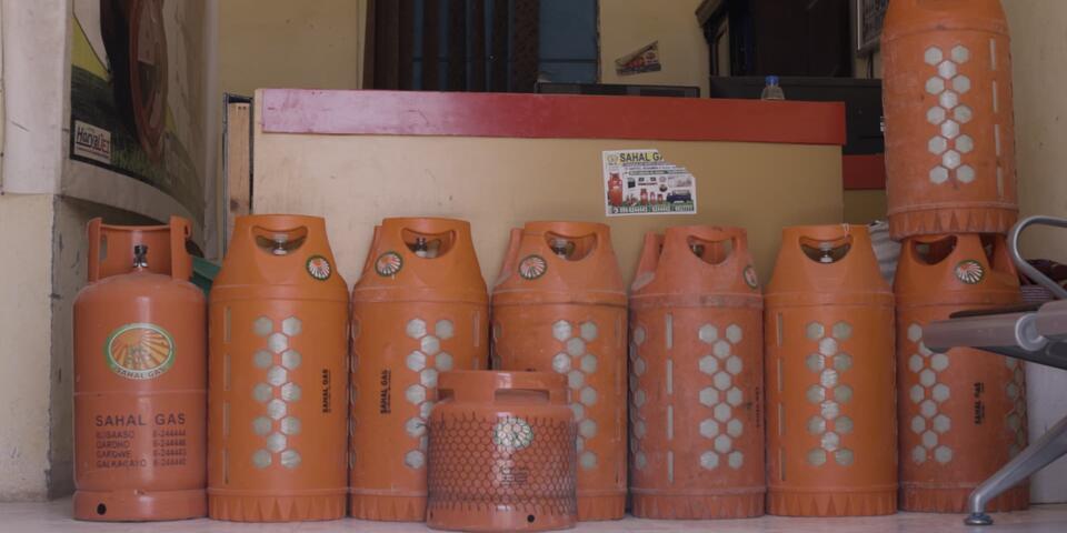 Orange containers in a line filled with gas