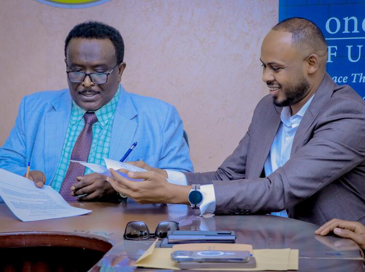 Minister of Investment and Industrial Development, HE. Abdirasak Ibrahim Mohamed, and Abdirahman Hashi, the Somaliland Director of Shuraako smiling after signing memorandum of understanding 