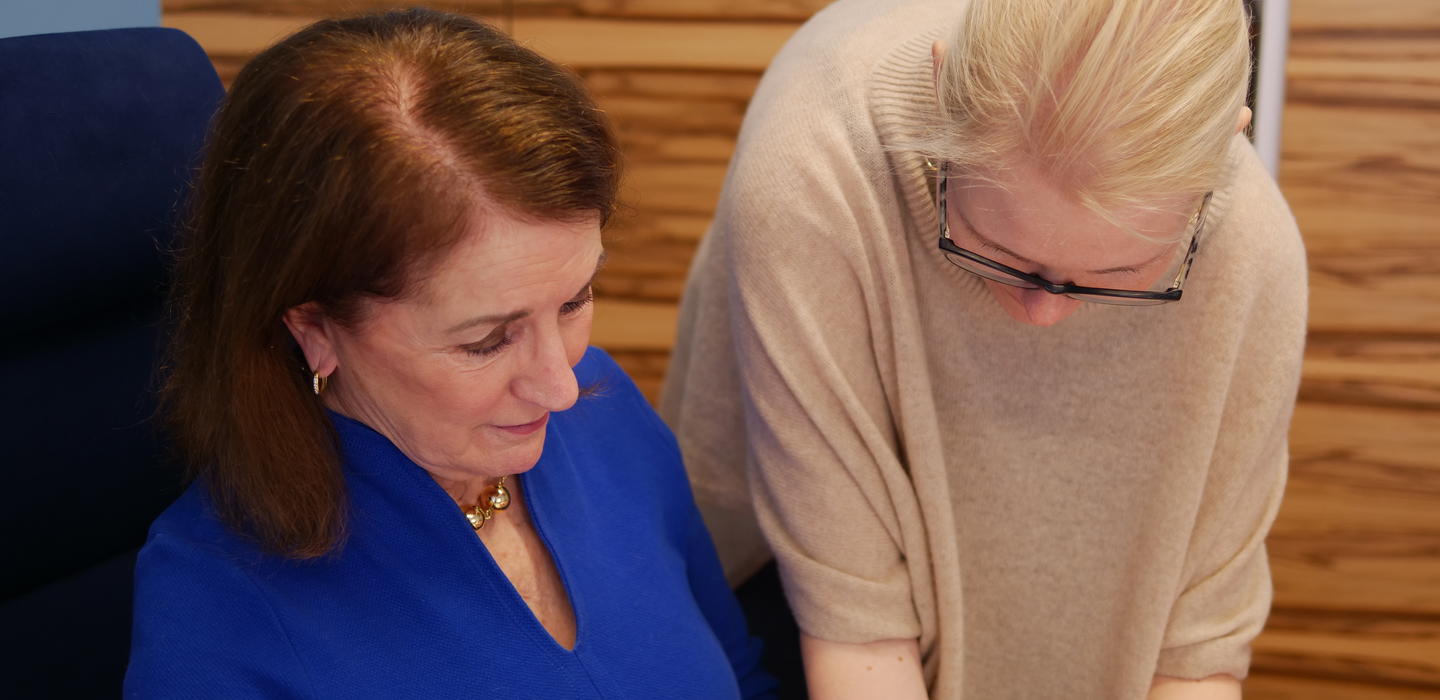 Laura and Veronika working on a document