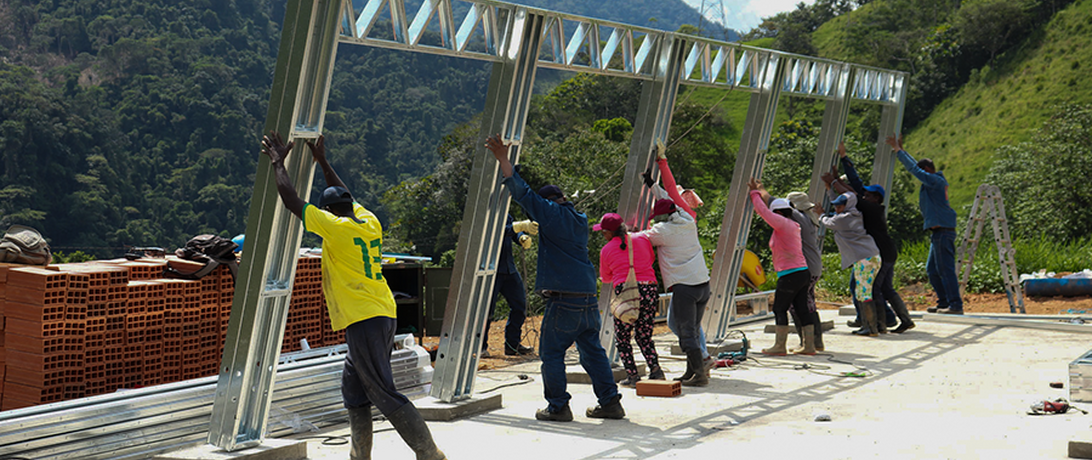 Raising a building frame in rural Colombia