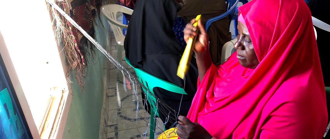 Somali women net mending making