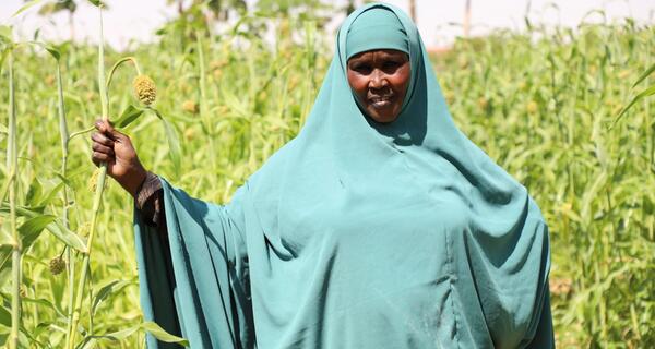 Somali Women standing in her farm