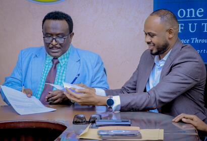 Minister of Investment and Industrial Development, HE. Abdirasak Ibrahim Mohamed, and Abdirahman Hashi, the Somaliland Director of Shuraako smiling after signing memorandum of understanding 