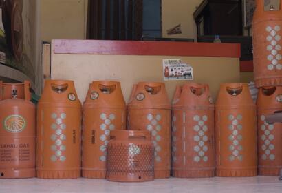 Orange containers in a line filled with gas