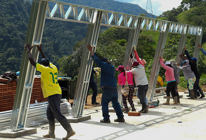 Raising a building frame in rural Colombia